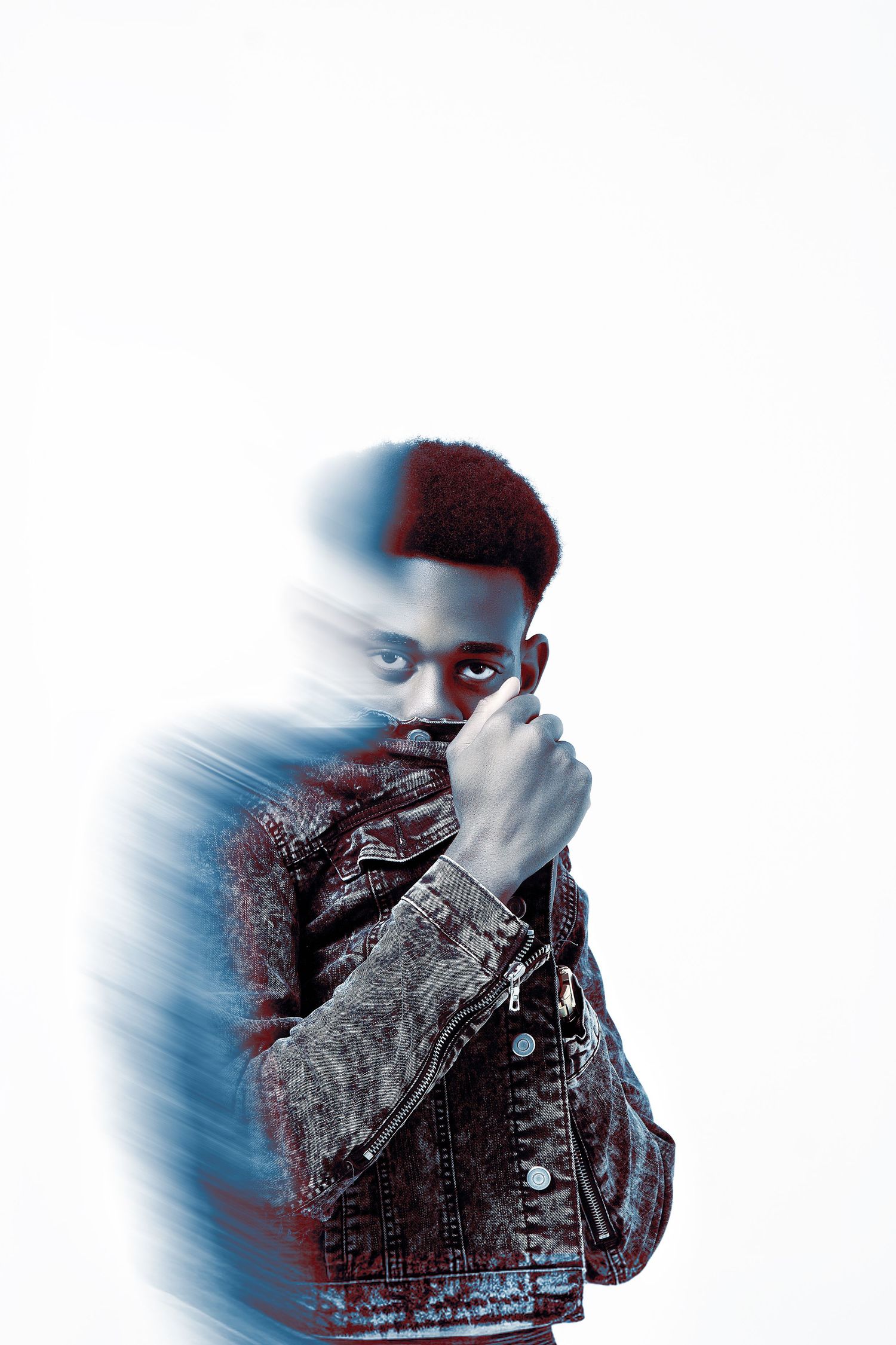 Artistic double exposure portrait with blue tones and dramatic lighting effects.
