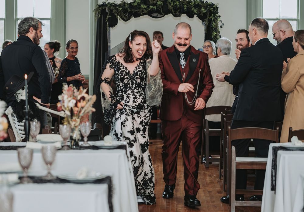 Wedding guests gather and mingle during a reception celebration in an elegant indoor venue located at Lemont Hall in Brunswick, Maine.