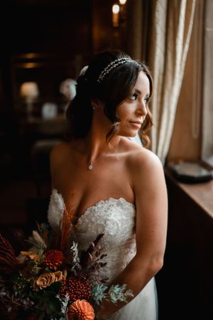 'bride looking out window'
