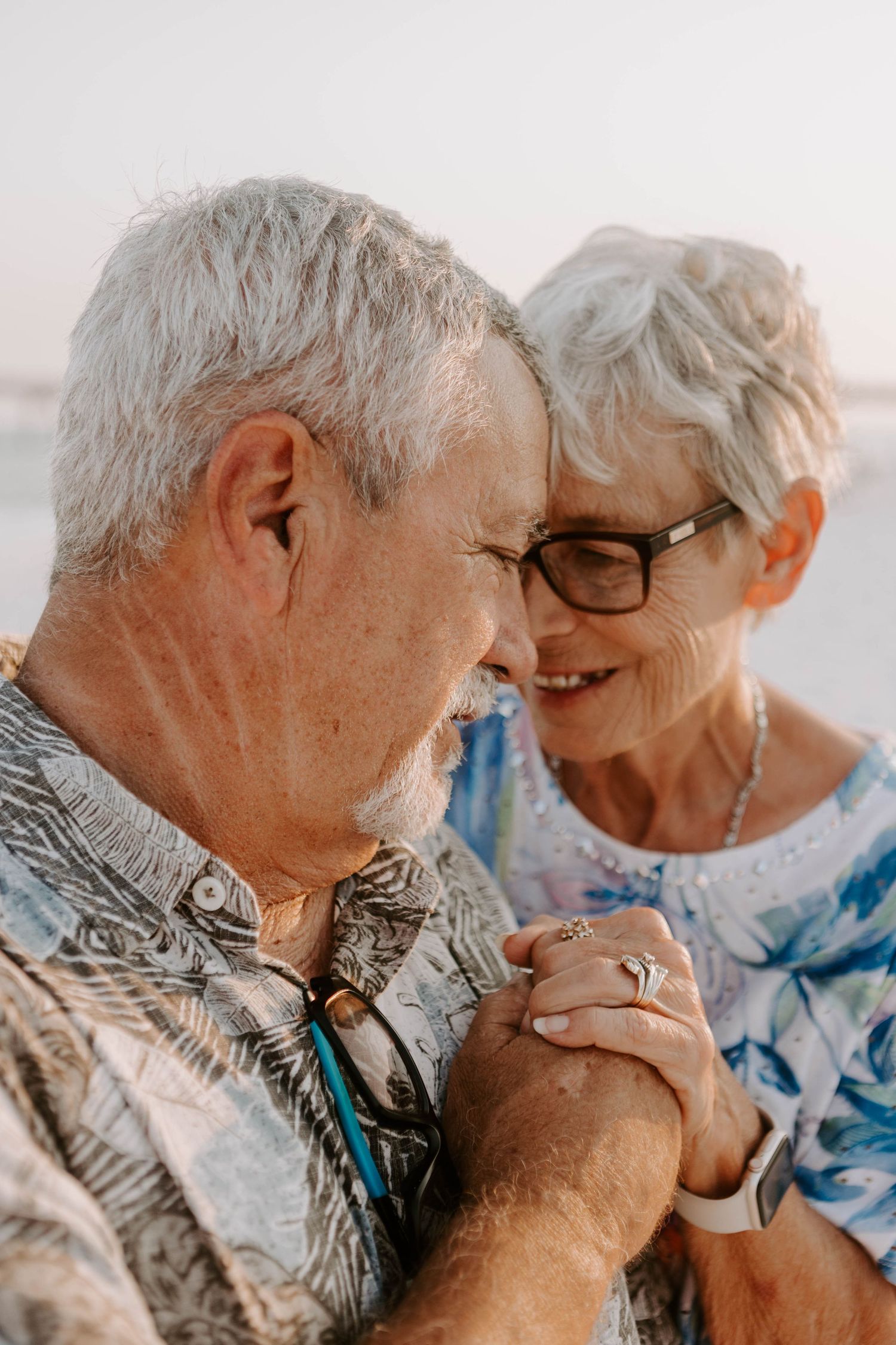 A couples session of an elderly couple embracing each other in Florida