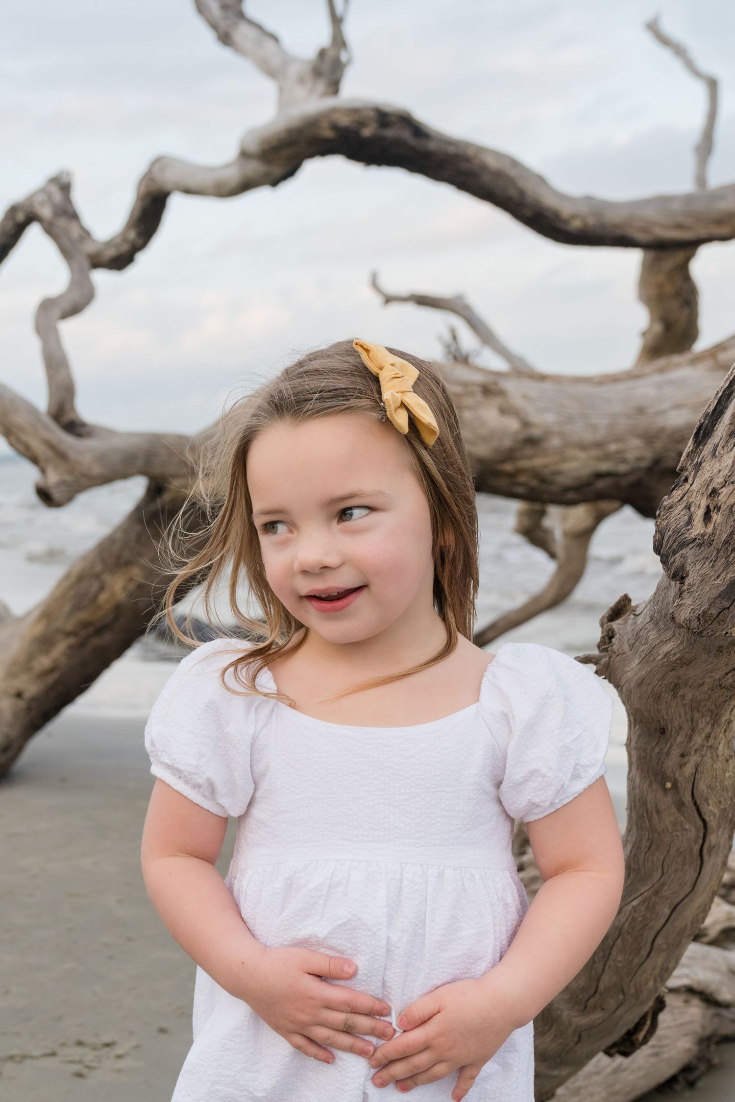 Three generations captured in a relaxed beach photo session on the Georgia coast.