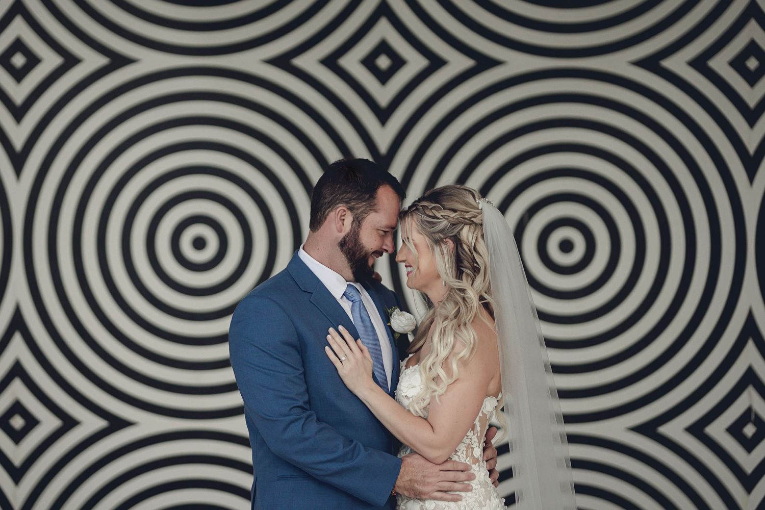 Wedding couple sharing a joyful moment during their photo session at The Fives Beach Hotel & Residences, Riviera Maya.