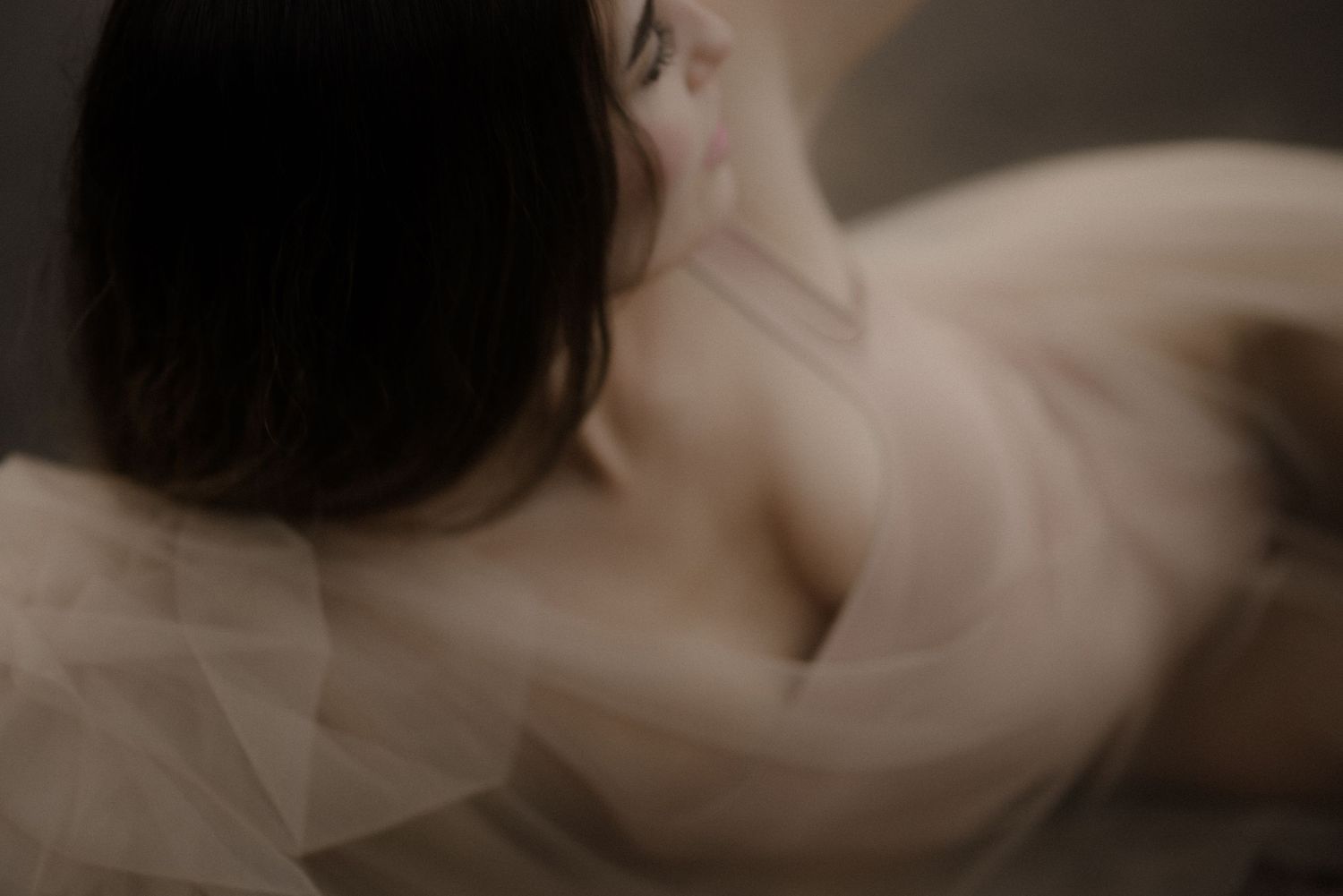 Artistic close-up portrait with soft focus and dreamy lighting effects.