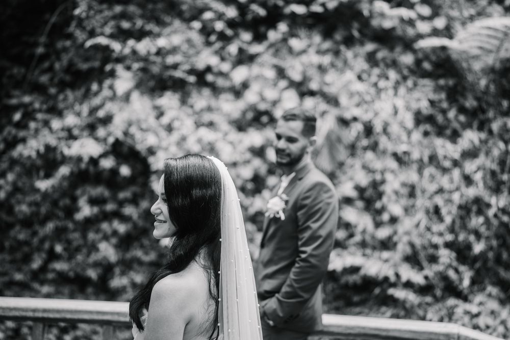Black and white wedding portraits showing intimate moments between newlyweds.