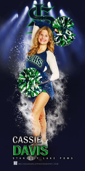 High school cheerleader sports photo with green and white pom poms and school logo against dark dramatic background.