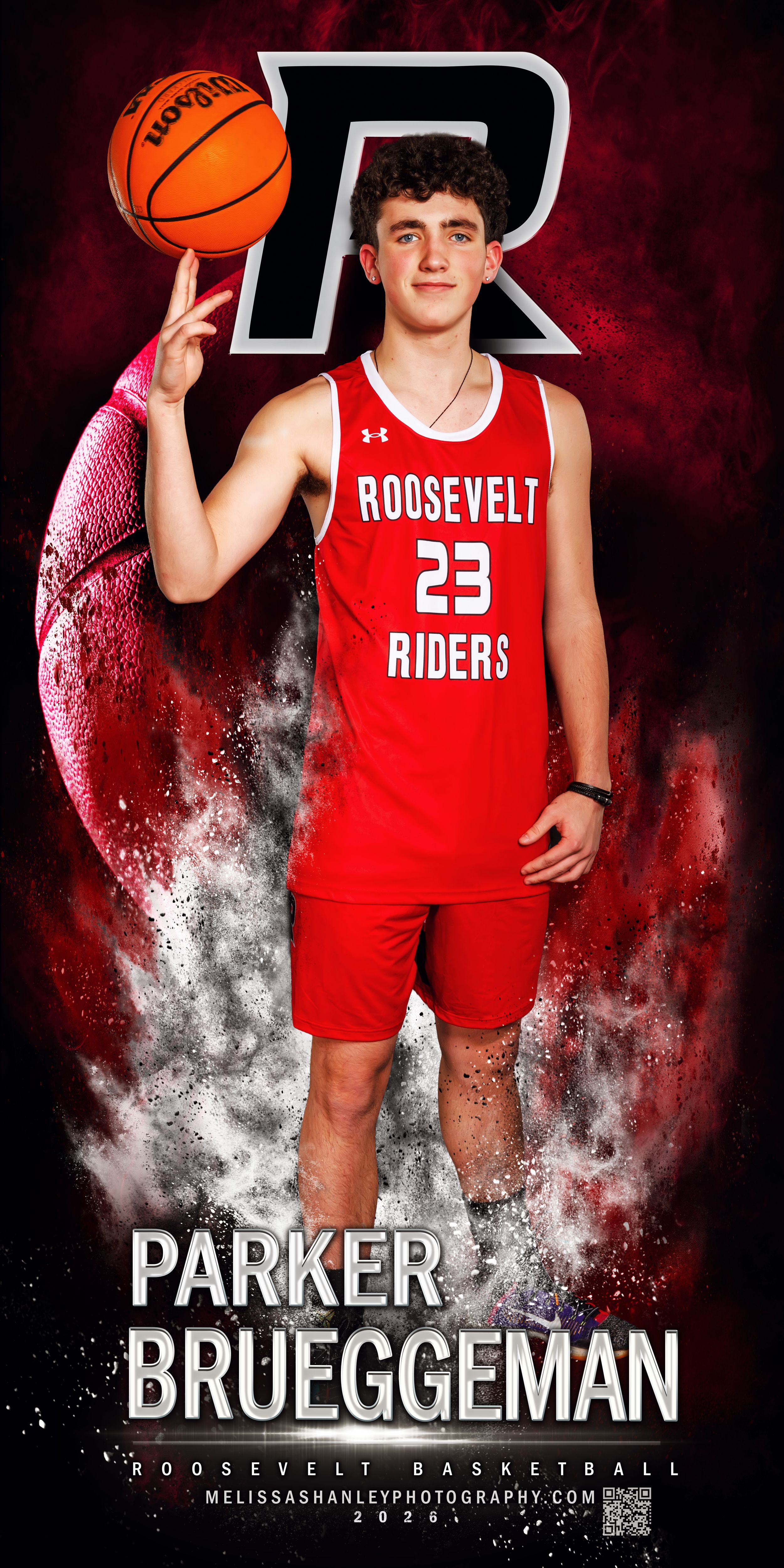 Basketball player in red Roosevelt uniform poses with ball against dramatic black and white smoke background.