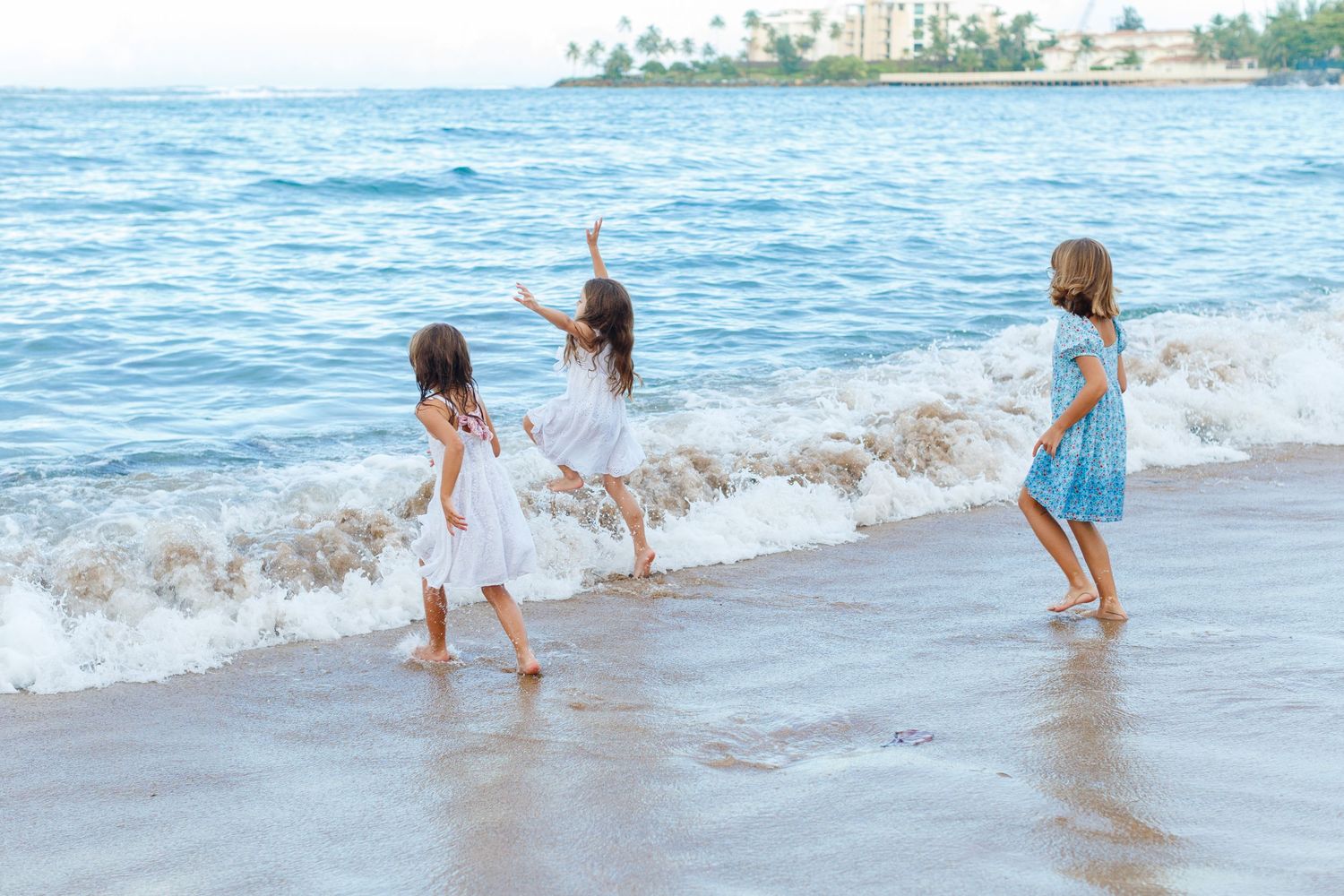 Three girls on the beach in Dorado, Puerto Rico.
