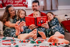 Magical Christmas family moments—snuggled in pajamas, reading together, and capturing the warmth of the season.