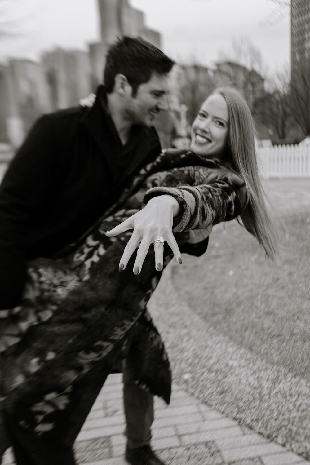 A romantic black and white photo sequence shows a playful couple lying in grass together.