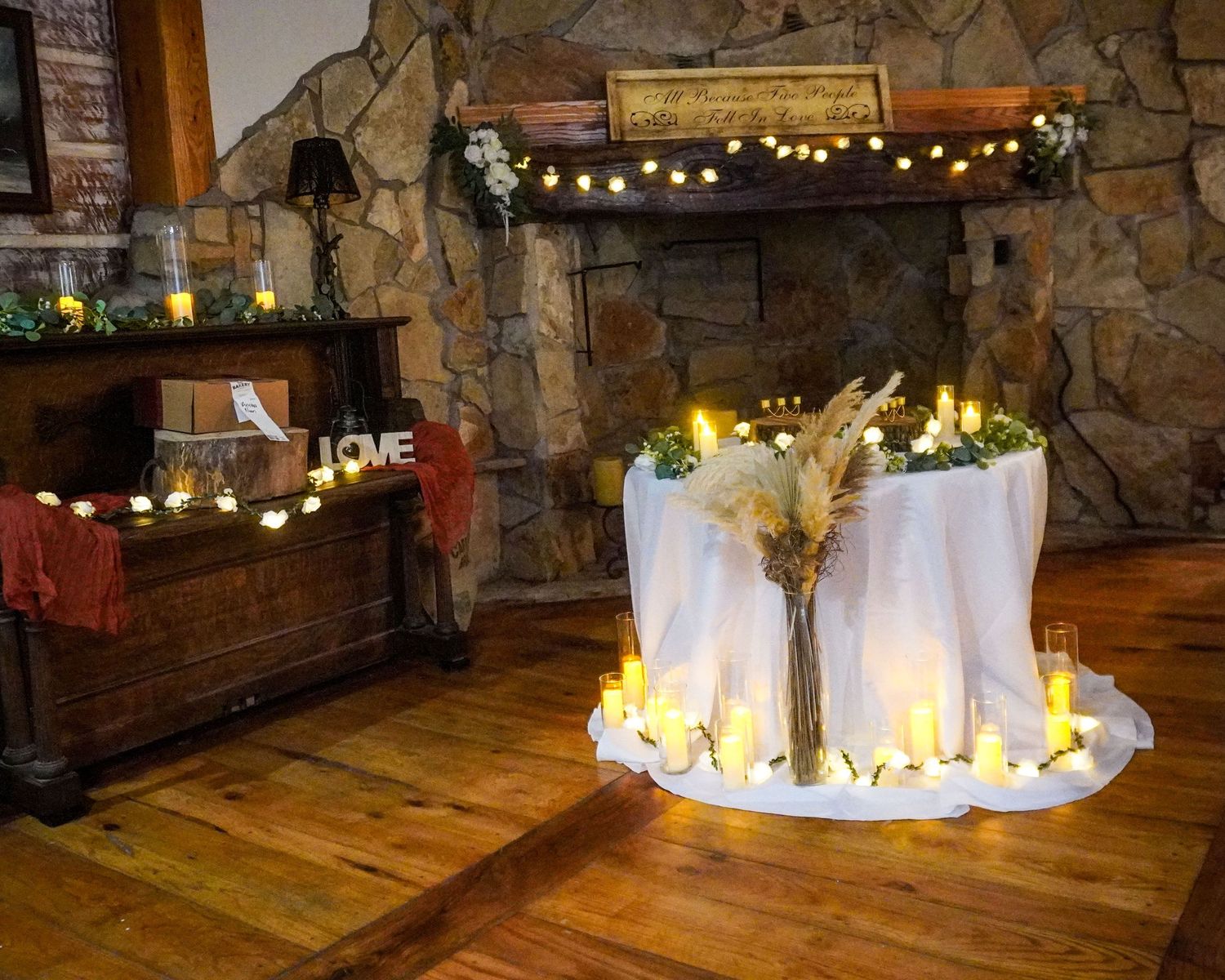 Collection of string lights with glowing golden sparkles illuminating stone walls and wooden flooring in a rustic space.