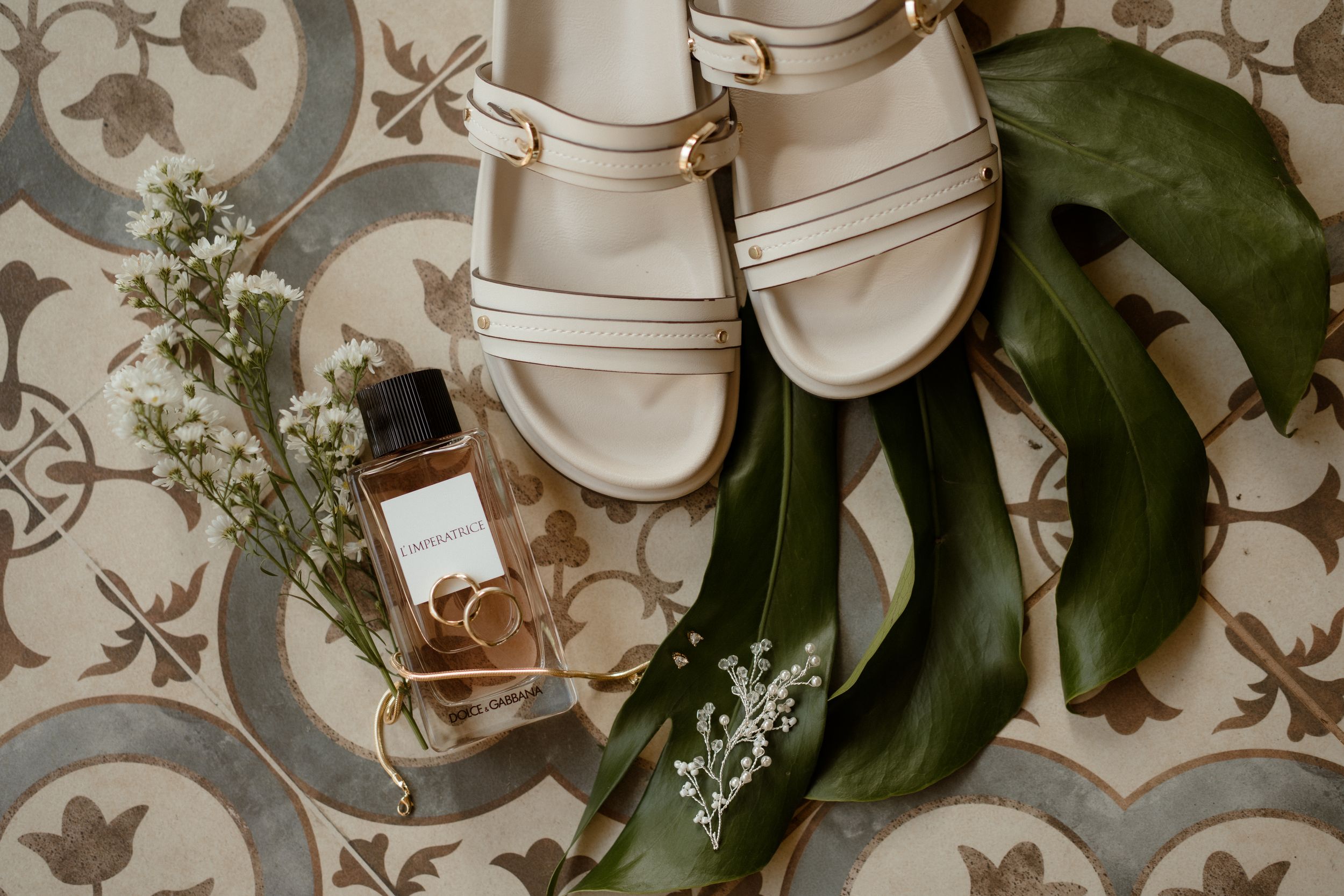 White ceramic vases arranged with delicate floral patterns and shadows.
