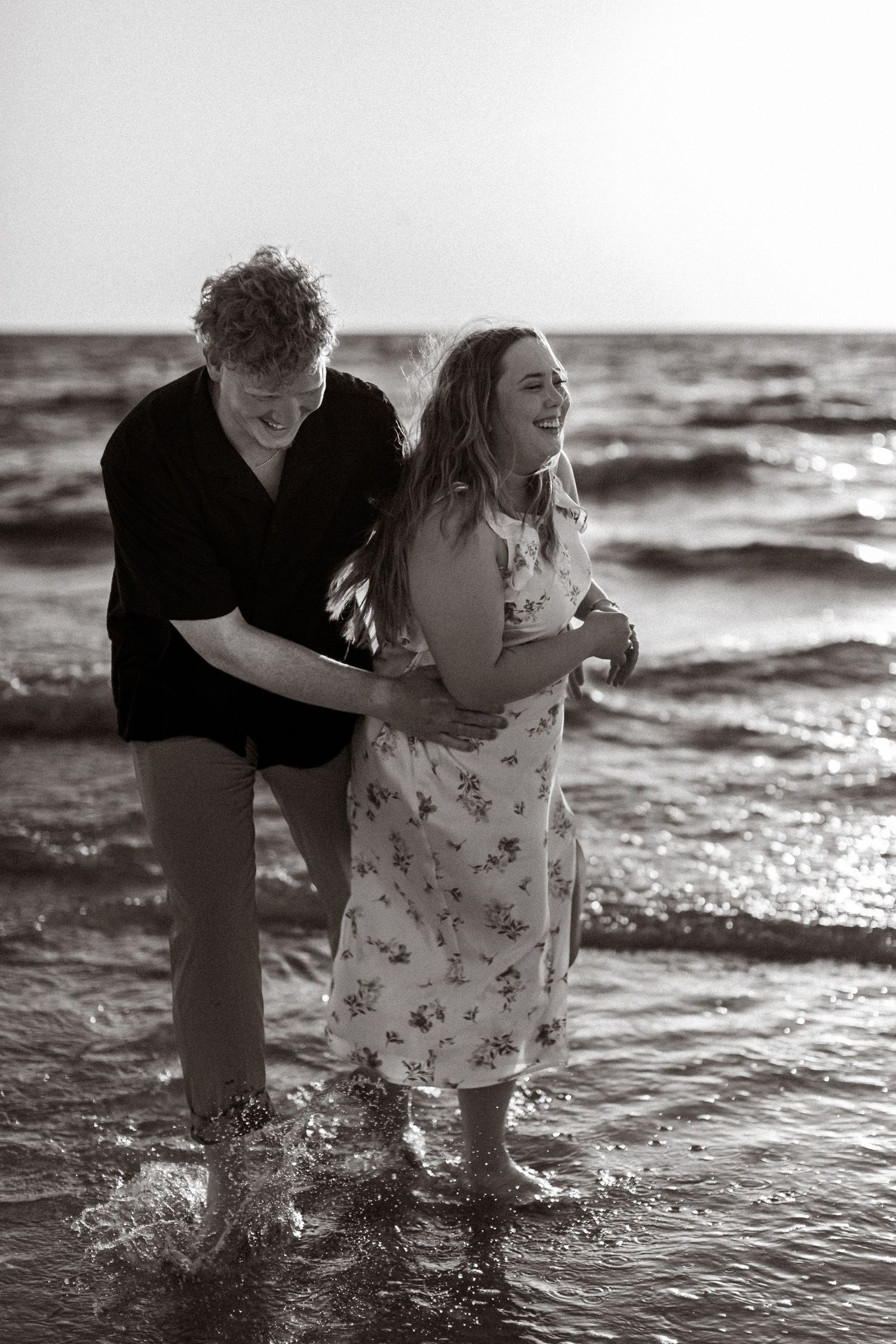 Engagement portrait of a couple at sunset on Clearwater Beach, Florida | Emotive storytelling photography in the Tampa Bay area.