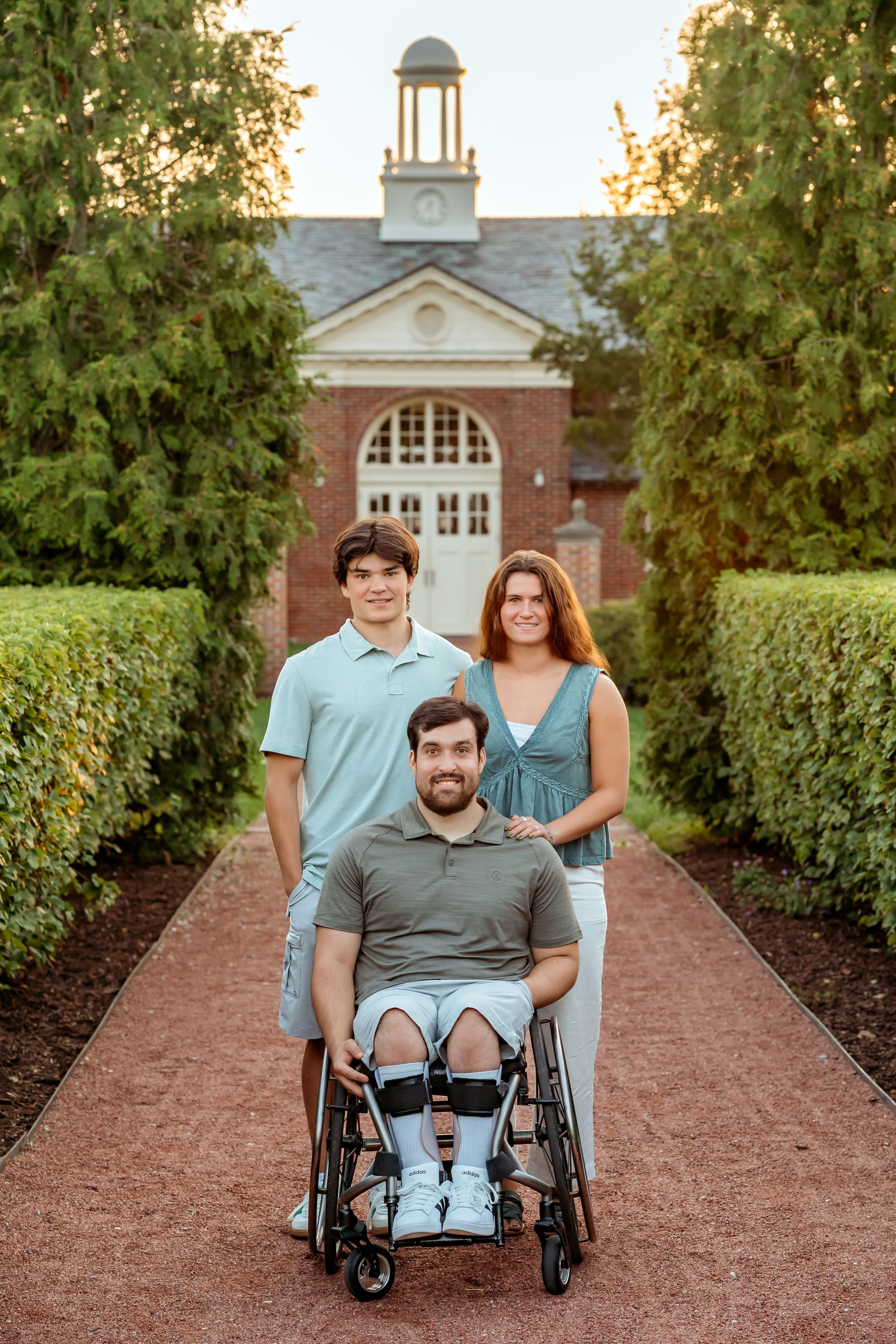 Three outdoor photos along a brick pathway with a wheelchair and historic building in background at sunset.