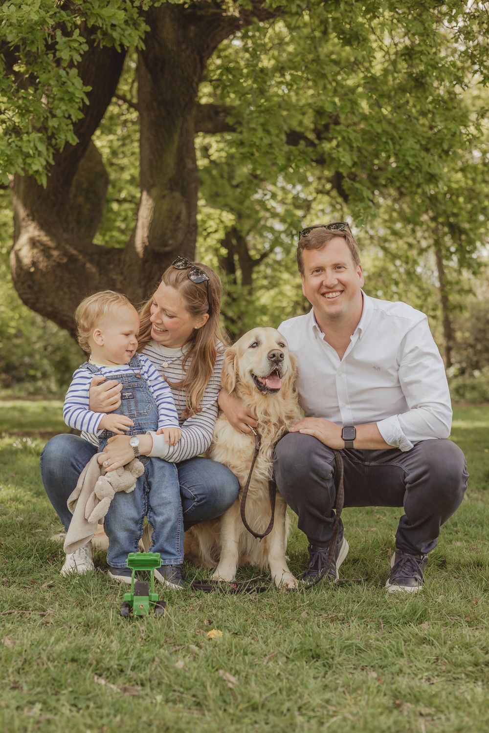 family photo of four with dog outdoors on Wandsworth common