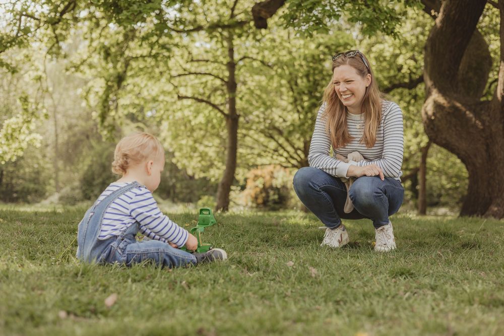 boy and mum sitting on the ground