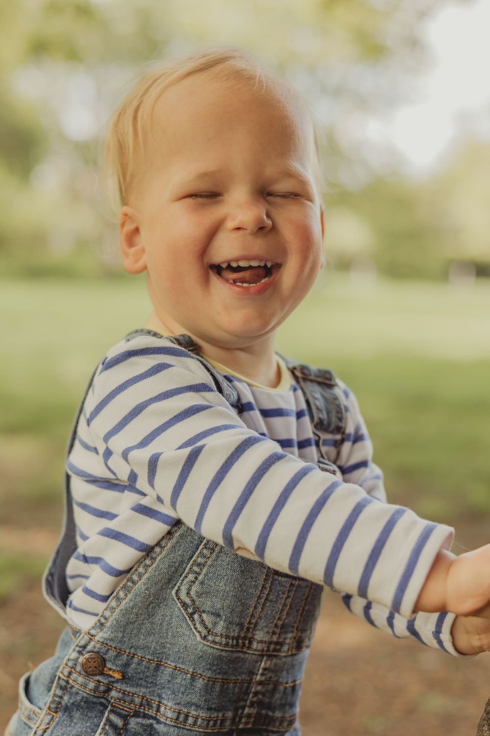 toddler laughing at camera