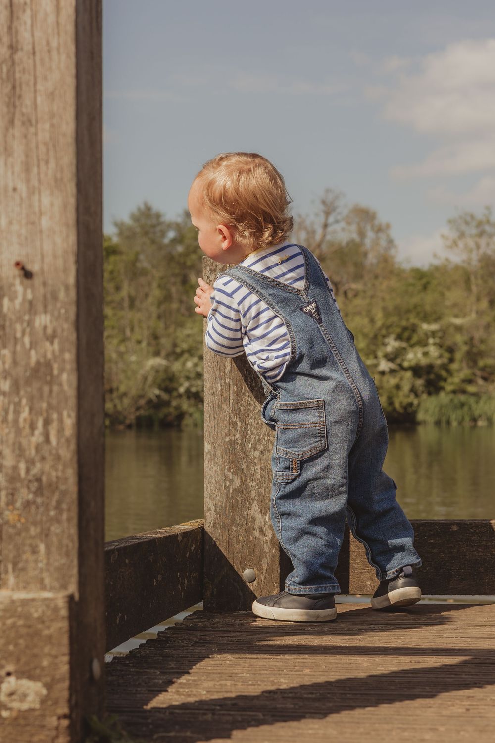 boy looking out over a pond