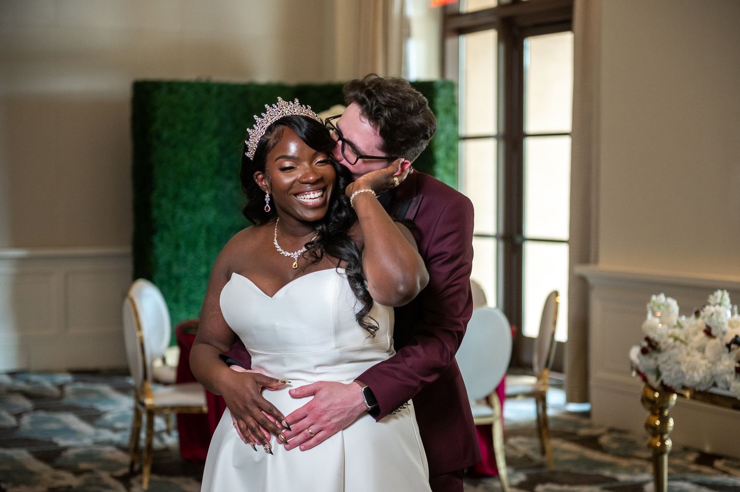 Candid moment of newlyweds sharing a laugh in front of an Orlando skyline backdrop, taken by a luxury wedding photographer in Florida.