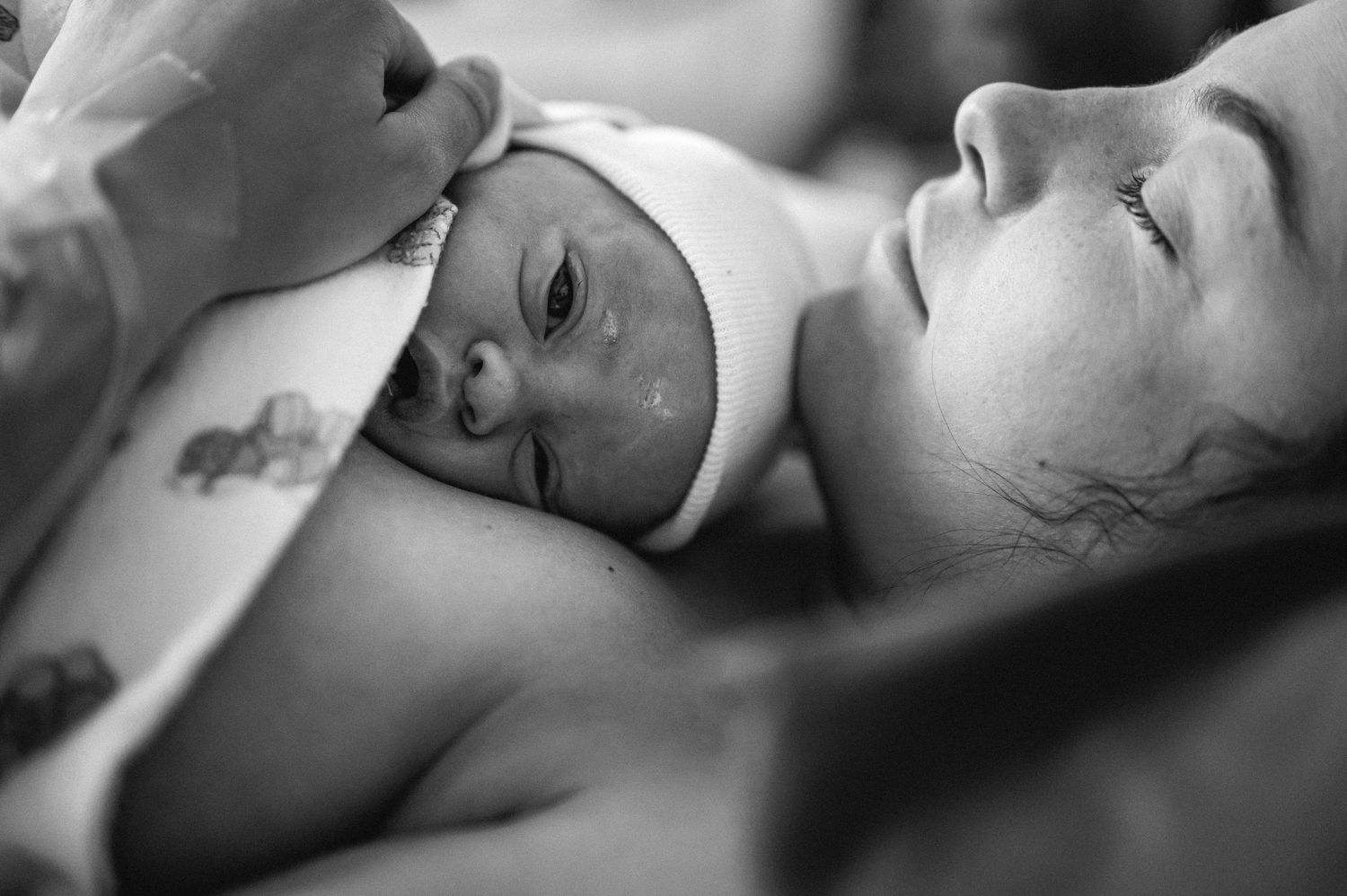 Black and white photograph showing intimate emotional expressions in an artistic portrait series.