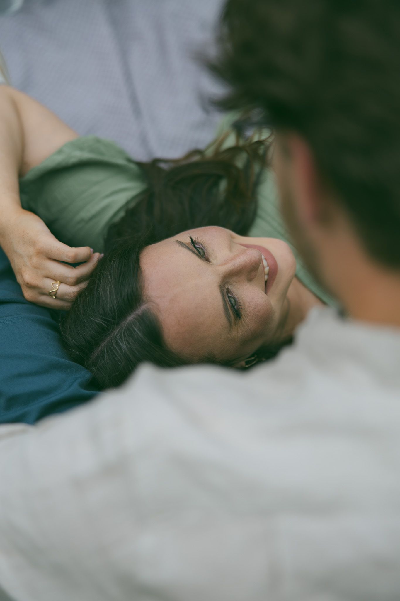 couple laying in lap detail shot beautiful face asheville photographer romantic proposal