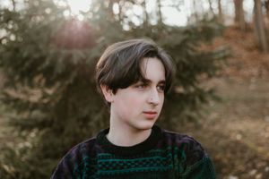Artistic portrait series showing different angles and poses in a moody autumn forest setting.