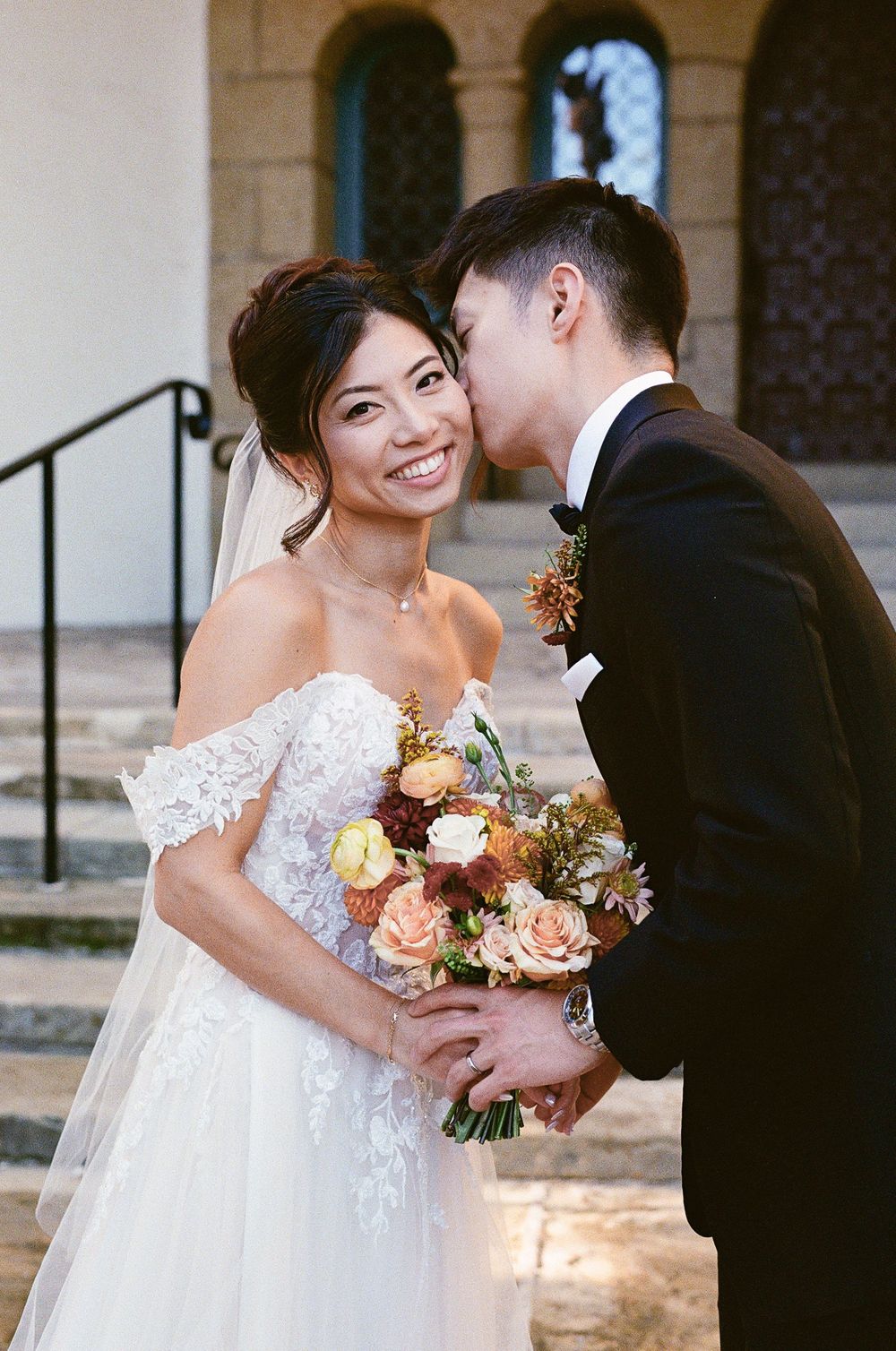 Close-up wedding portrait of a couple at the Santa Barbara Courthouse, captured on 35mm film for a timeless, editorial look.