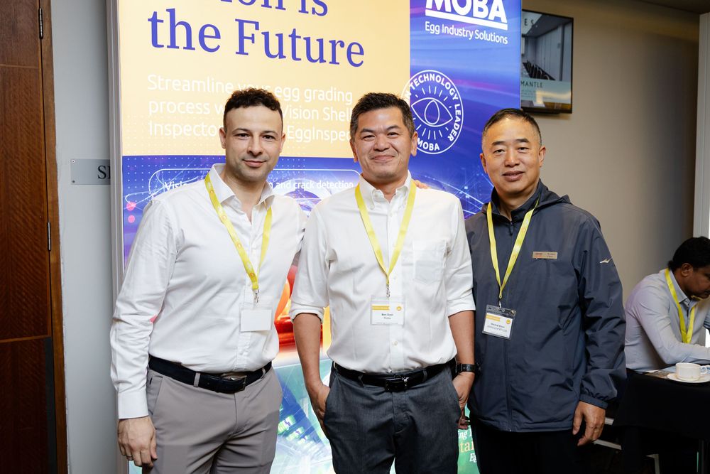 Fremantle Conference Photographer captures three attendees posing together at a professional conference