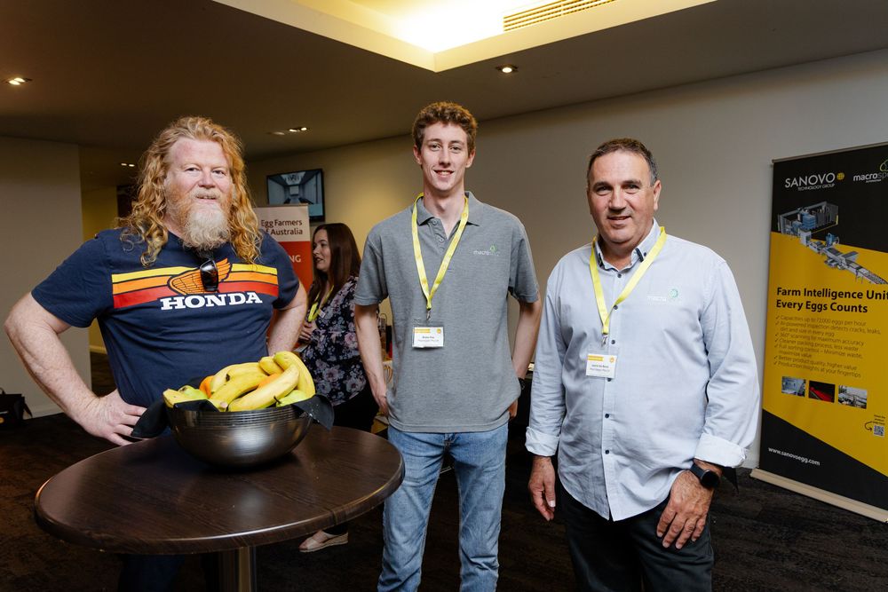 Group of people gathered around a table during a Fremantle Conference