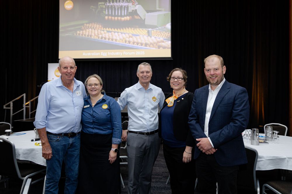 A group of five people photographed together by a Fremantle Conference Photographer