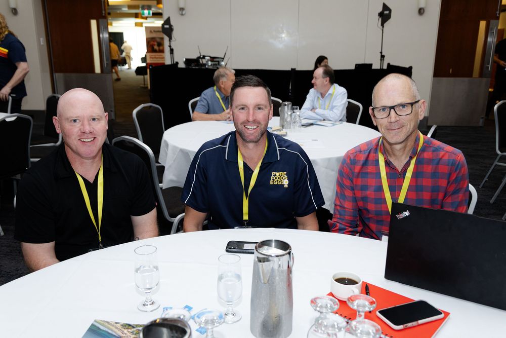 Fremantle Conference Photographer takes photos of people sitting around a table during a conference event