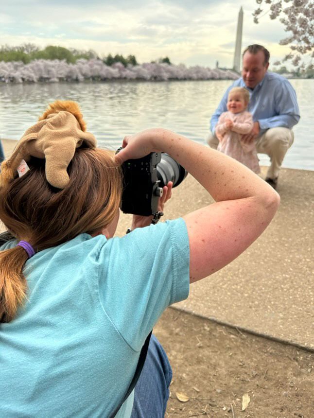 Northern Virginia family photographer Sarah Thayer uses a stuffed animal on her head to make kids smile during a playful session.