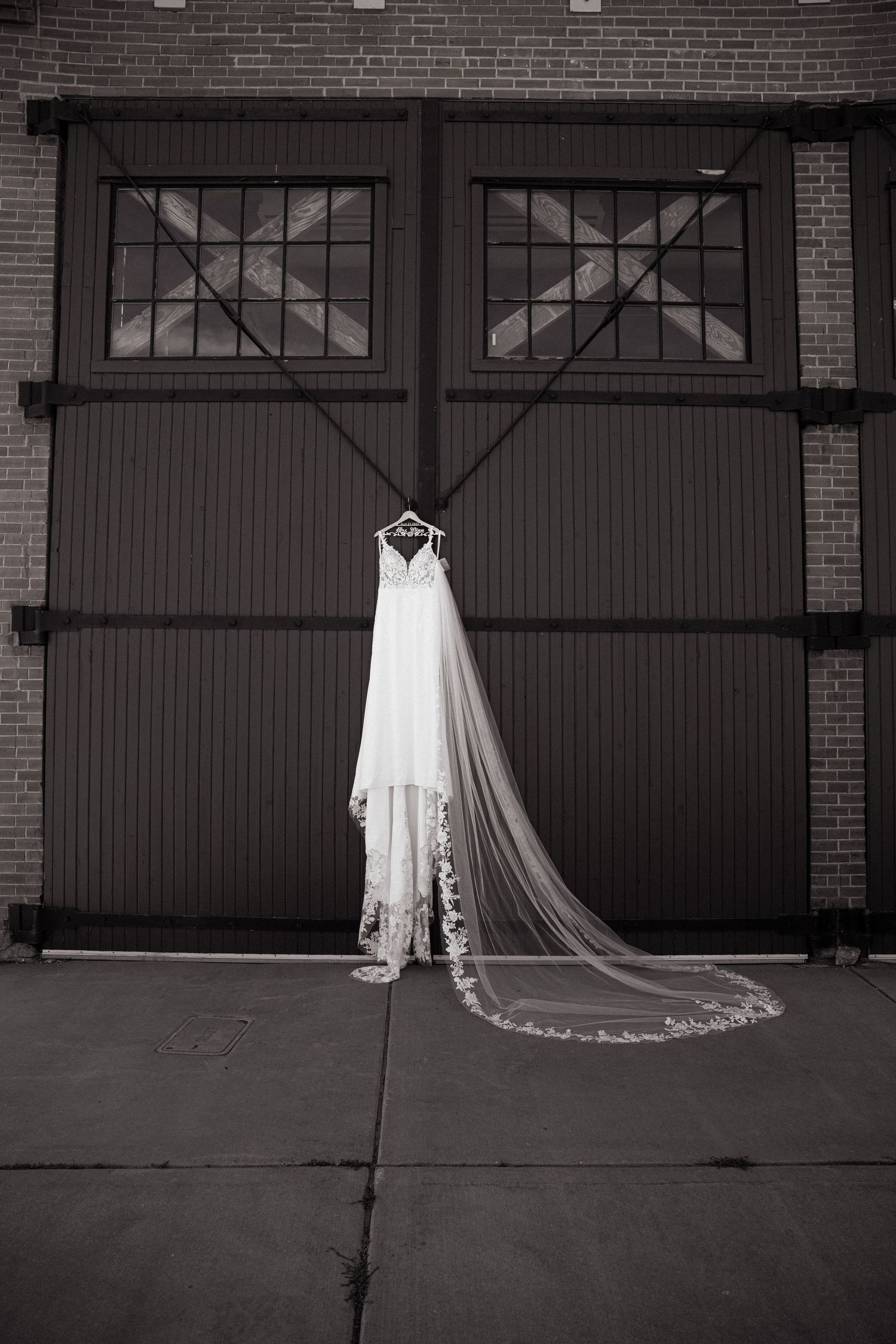 Wedding dress detail on big barn door