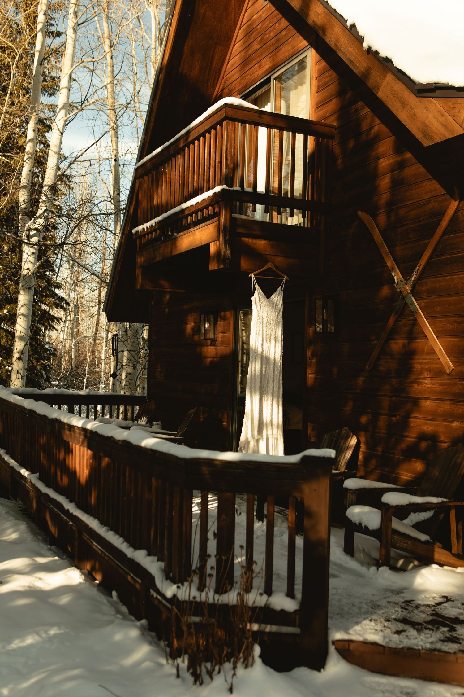 Idaho VRBO elopement - dress hanging from deck