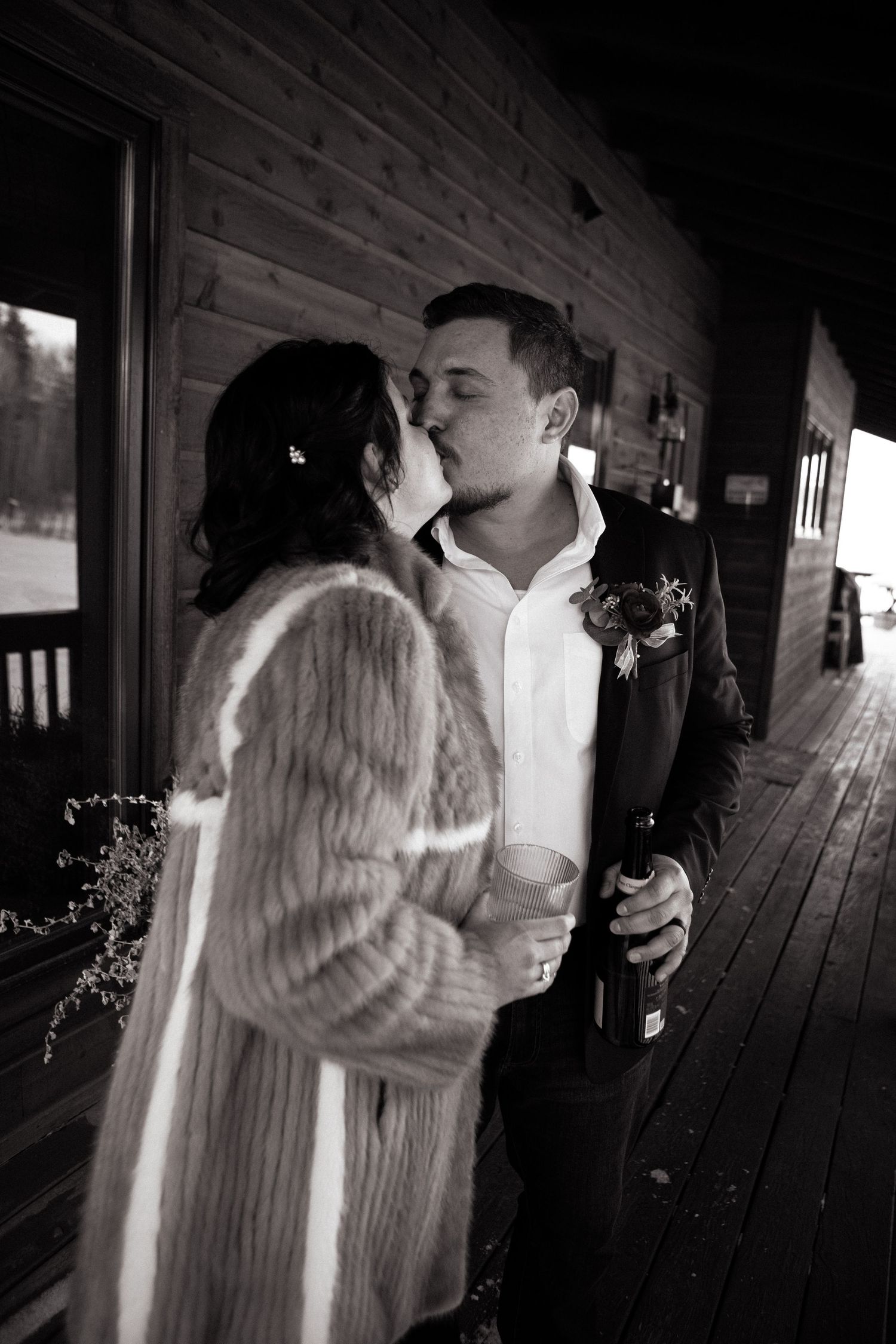 Kissing on the deck at a VRBO after Elopeement