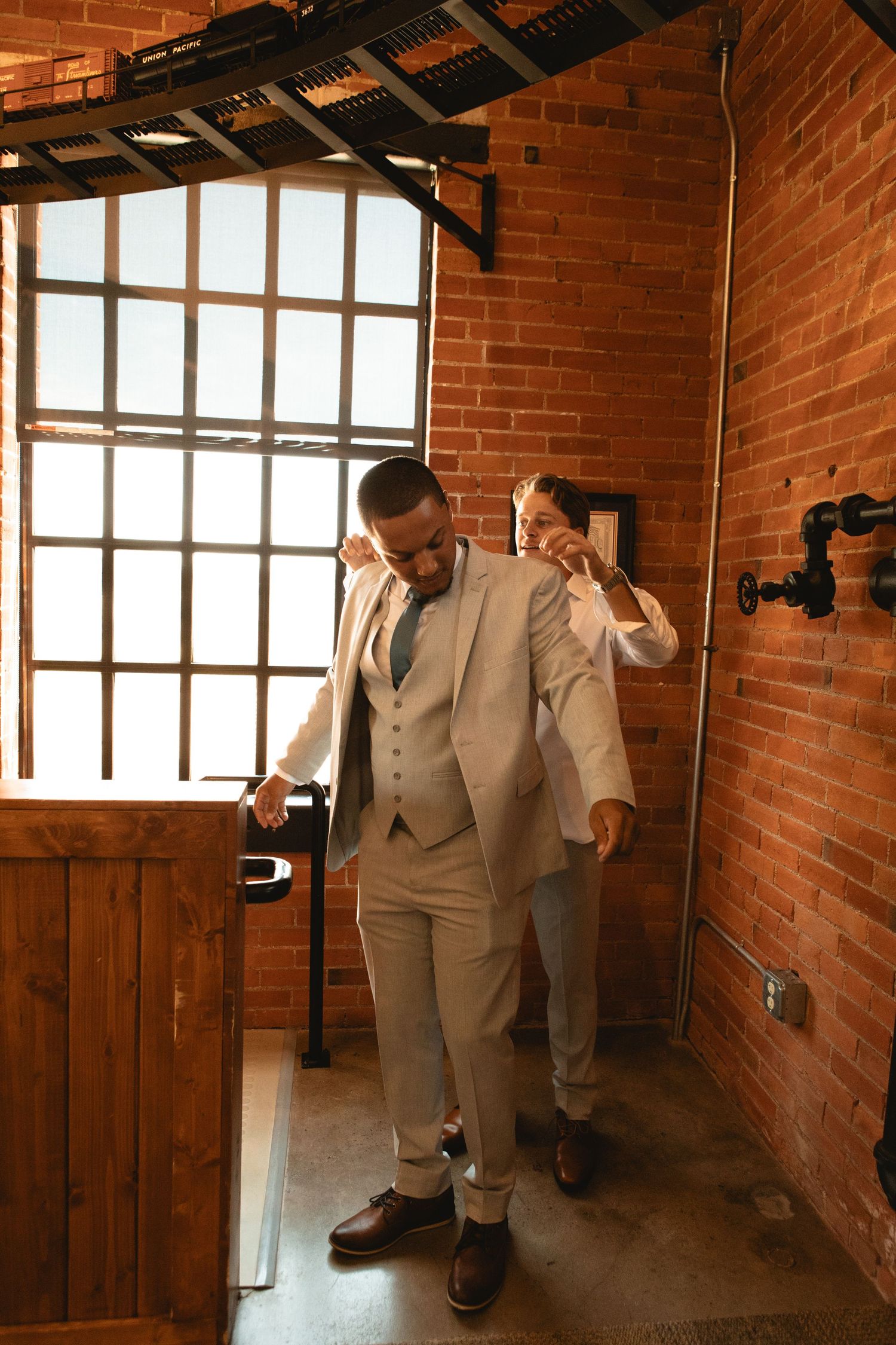 Groom getting ready with his best man