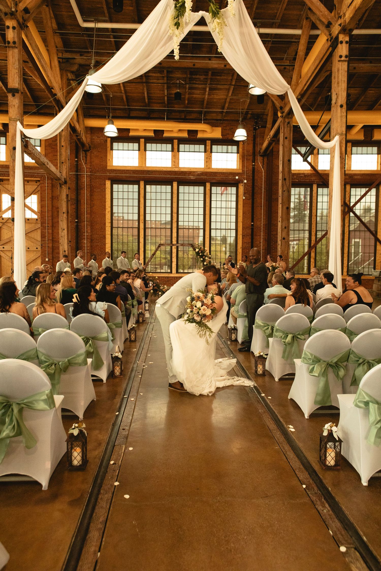 Walking down the aisle after saying i do at the Railyards Venue in Evanston Wyoming