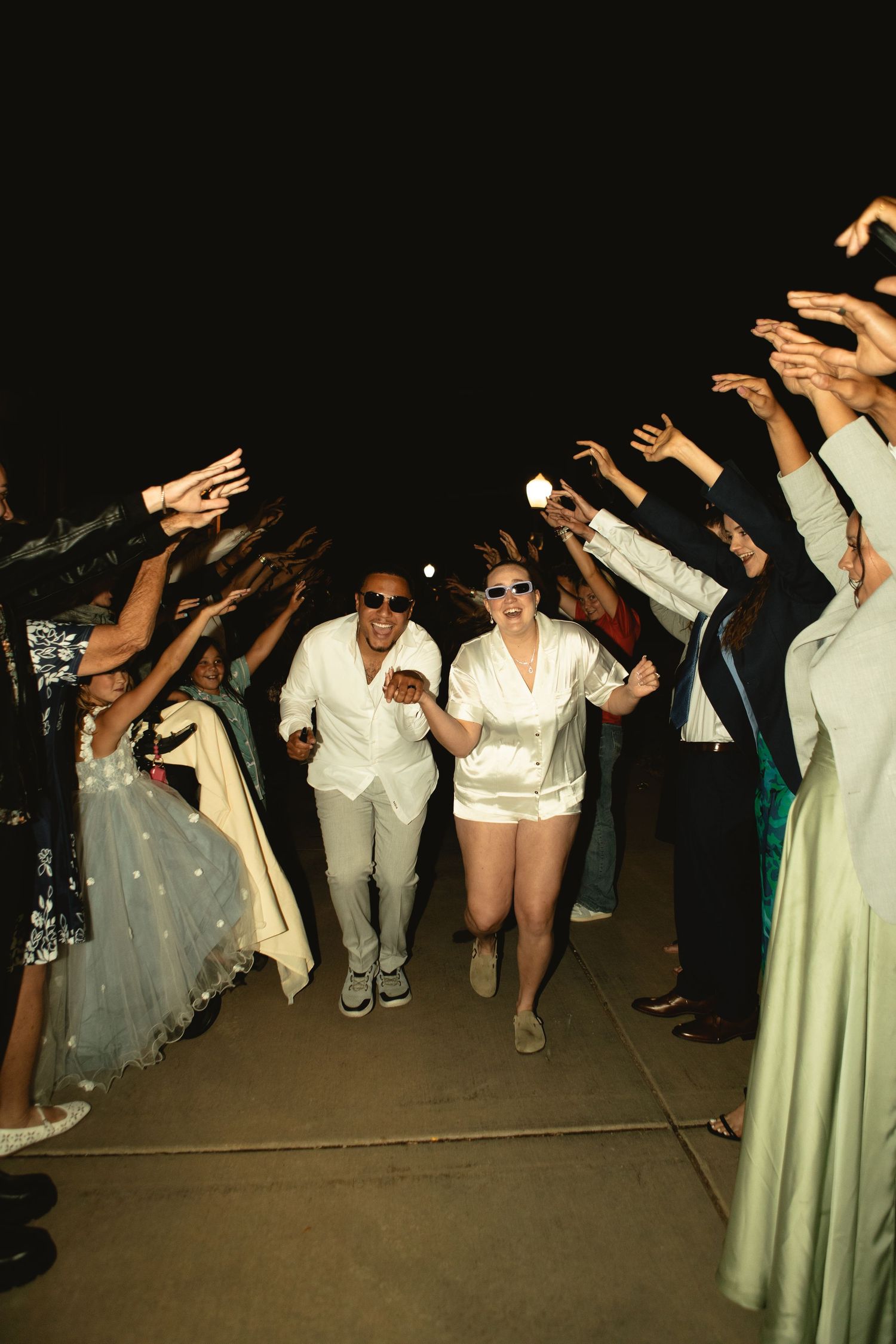 Grand Exit after wedding with sunglasses