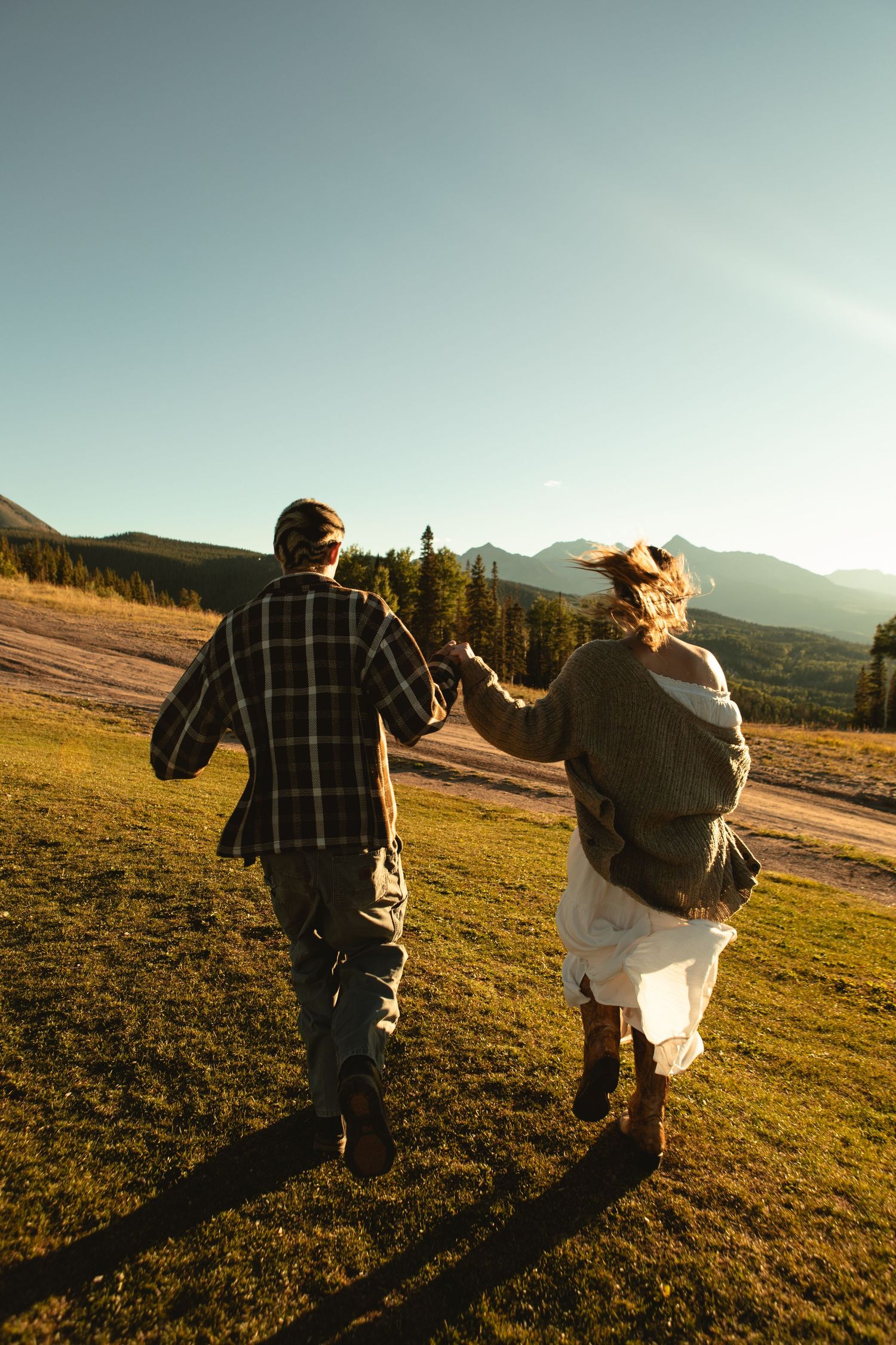 Couple running from camera