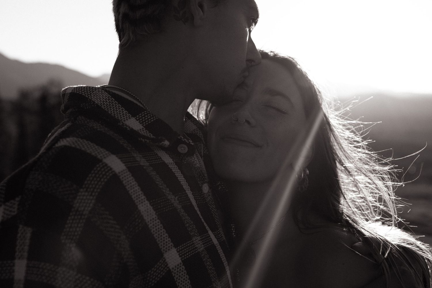 Perfect sun glare forehead kiss