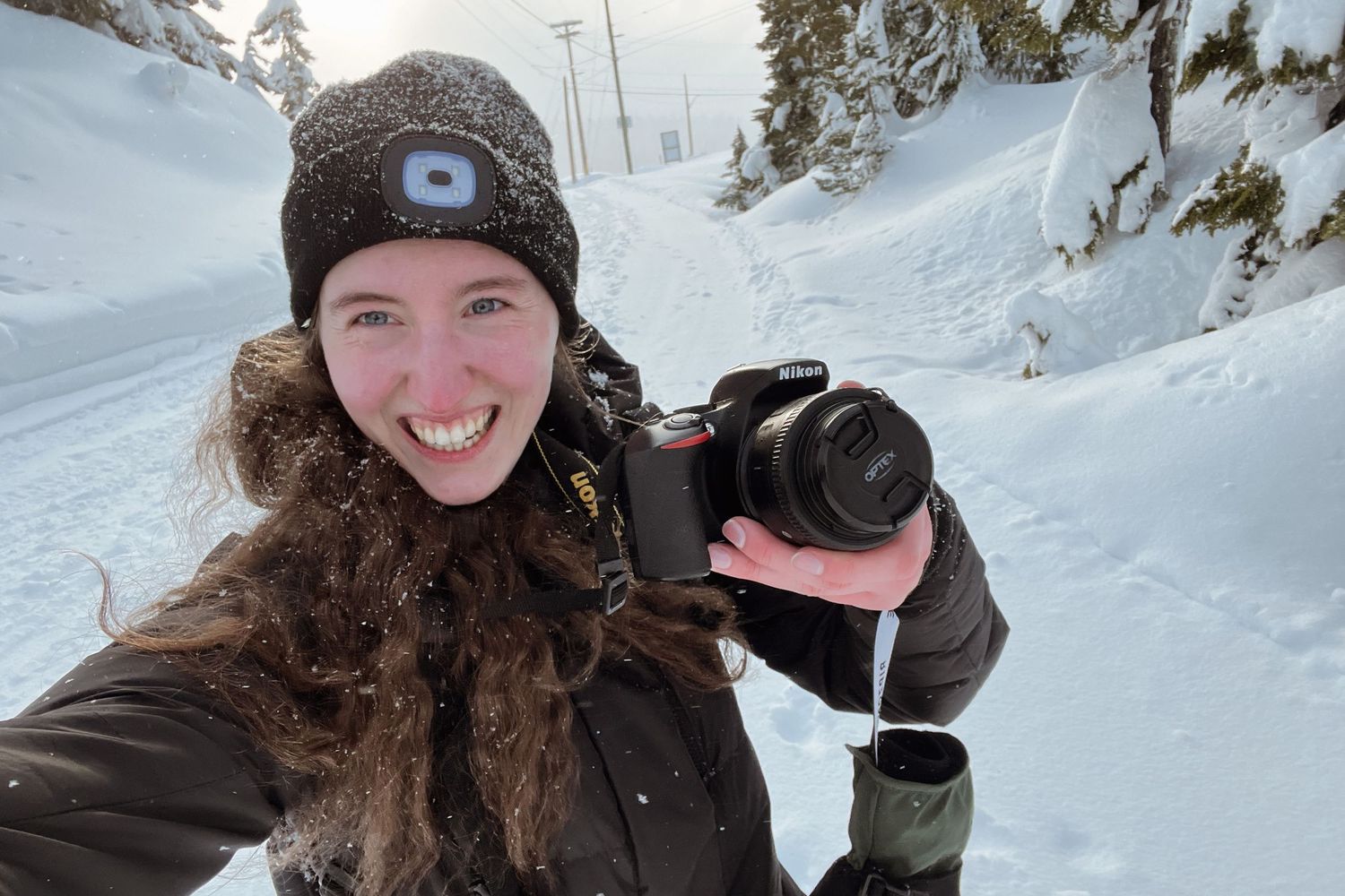 Katie Phillips (Soulfull Photographs) the photographer on Mt. Washington in the snow with her camera taking a selfie