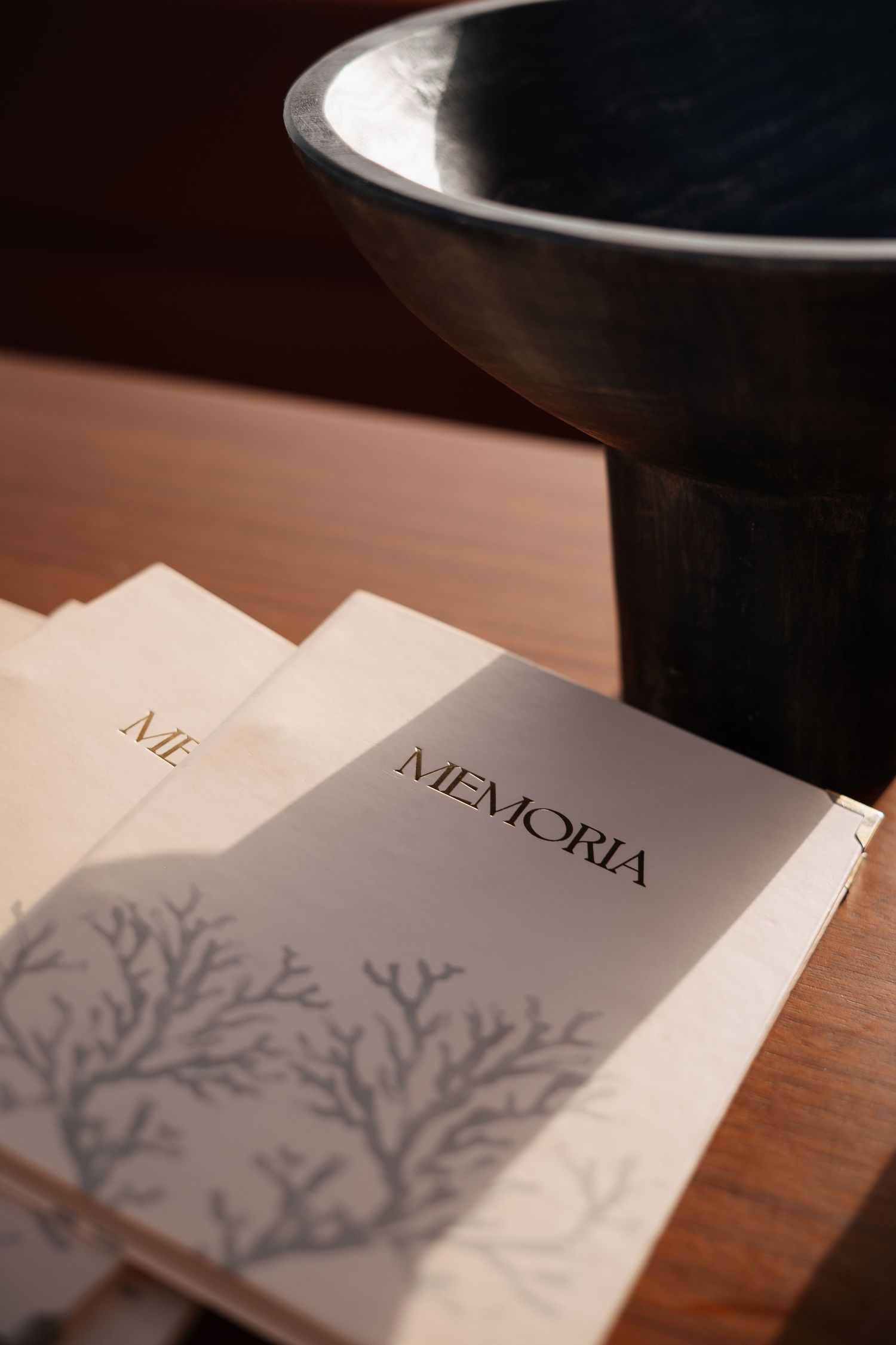 Restaurant menu with tree branch design on white paper.