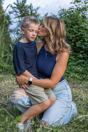Candid outdoor moments captured in natural setting with soft lighting.