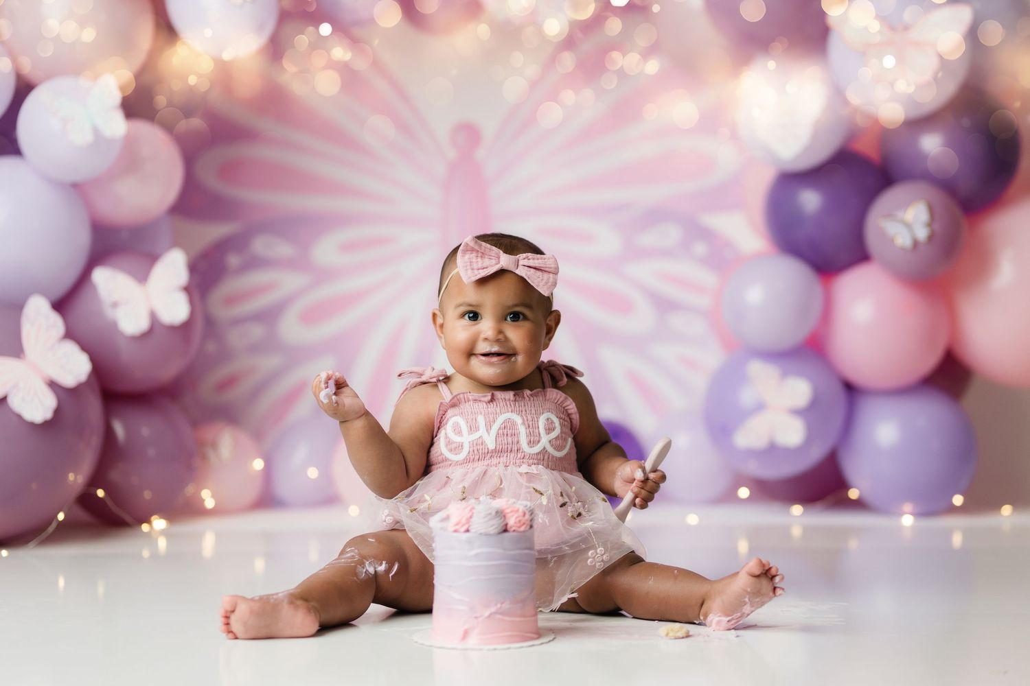 Beautiful baby girl butterfly smash cake session