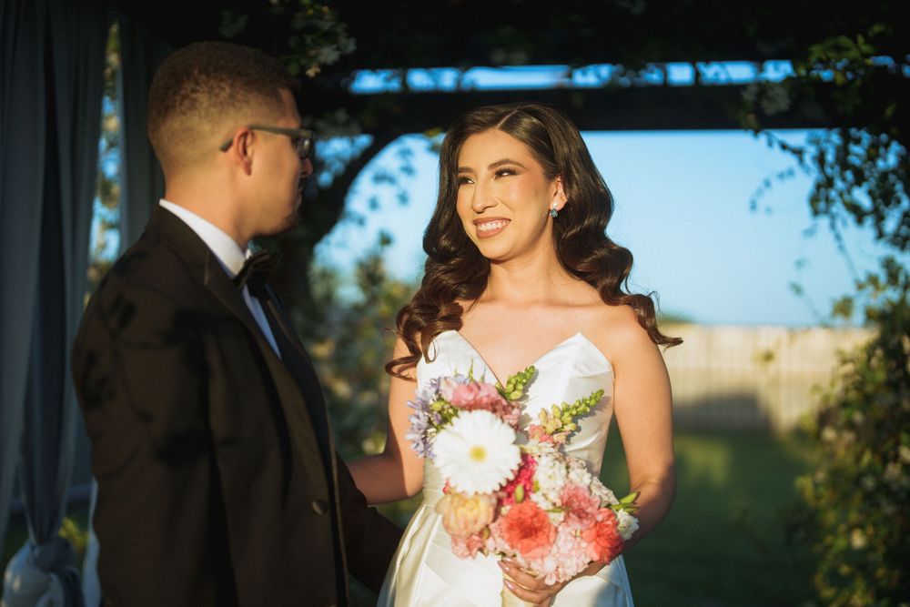 A couple shares a special moment during their outdoor wedding ceremony.
