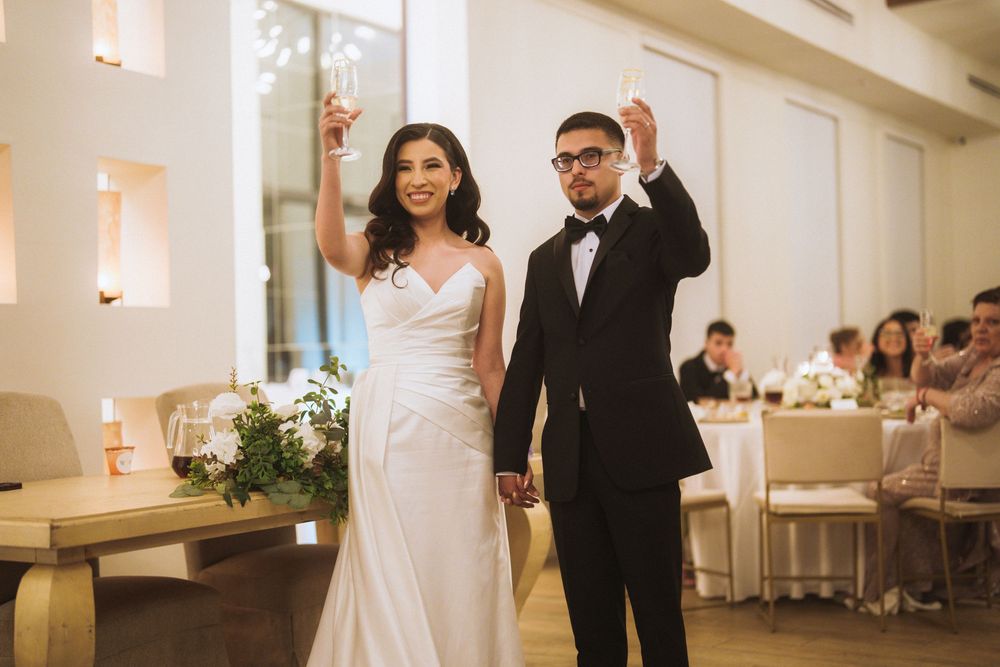 Wedding celebration in an elegant ballroom with warm lighting and romantic atmosphere.