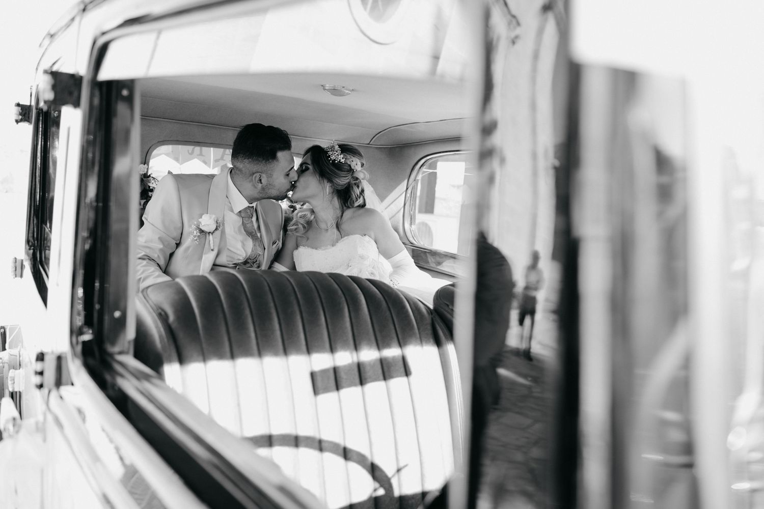 A grid of five monochrome photographs showing various interior views of vintage car windows and passengers.