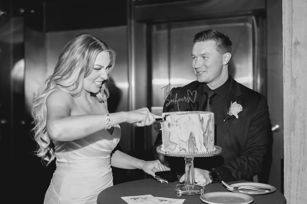 A five-photo collage showing various intimate wedding reception moments including cake cutting and dancing in black and white.