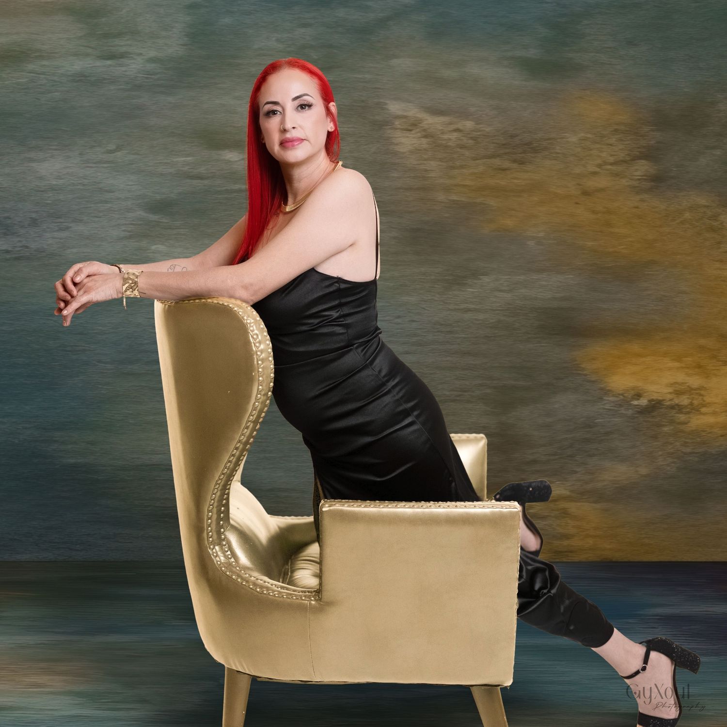 A figure in a black dress poses artistically across multiple frames against a textured backdrop.