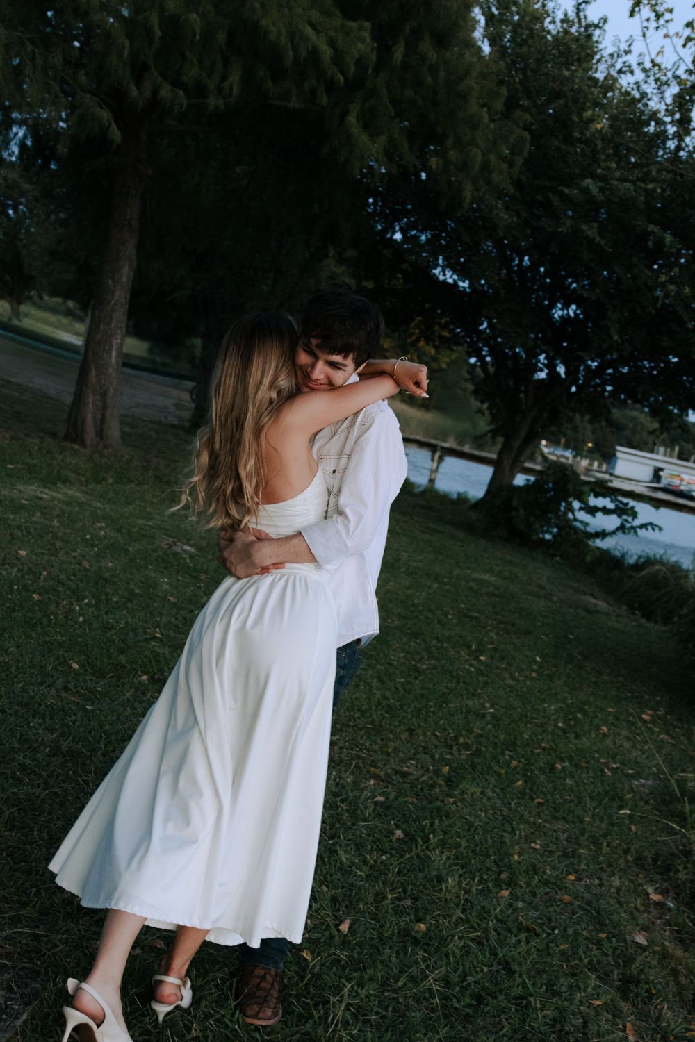 A series of intimate moments between a couple in white clothing captured in an outdoor garden setting.