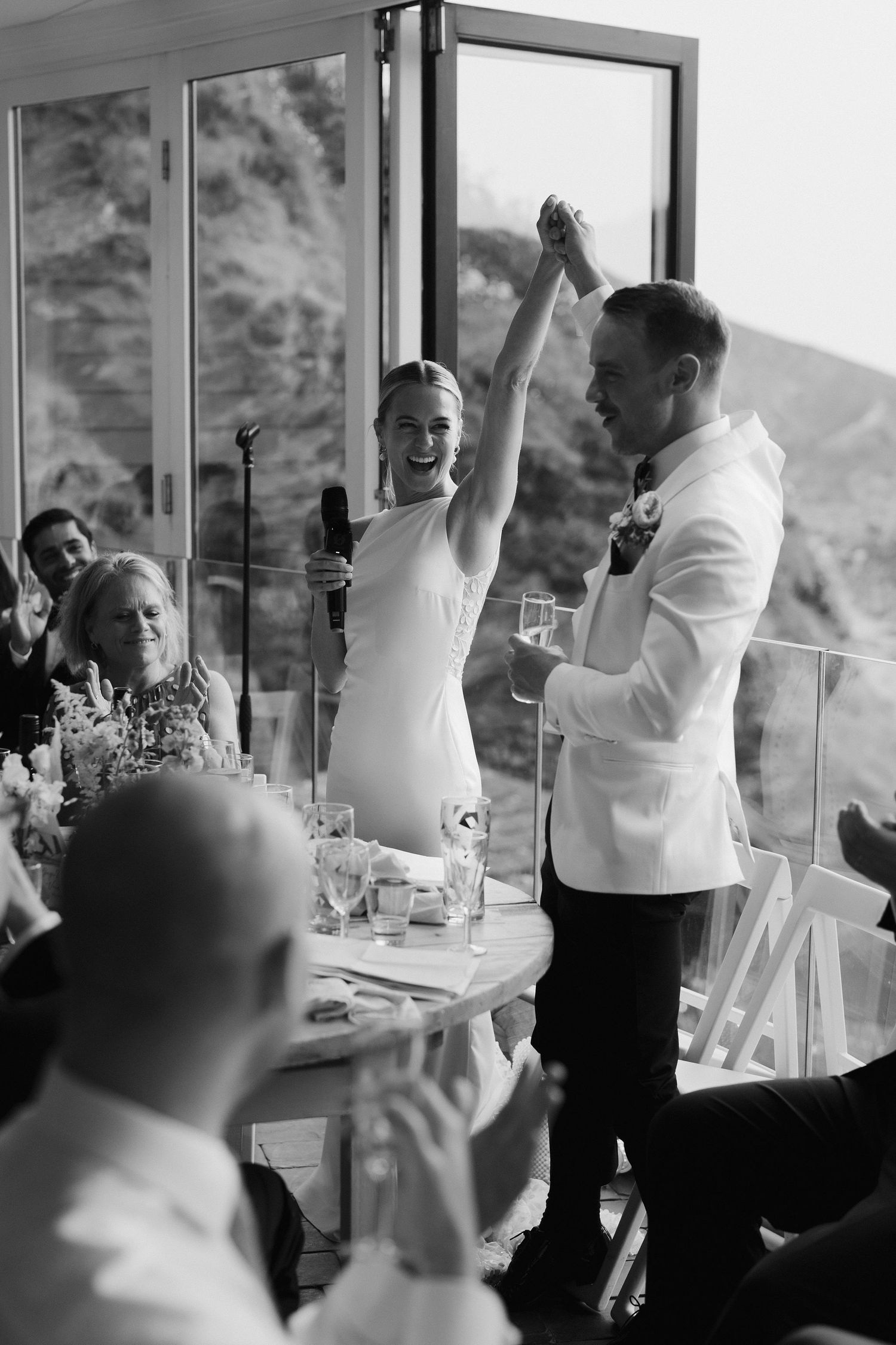 bride and groom celebrating wedding at tunnels beach wedding venue in north devon